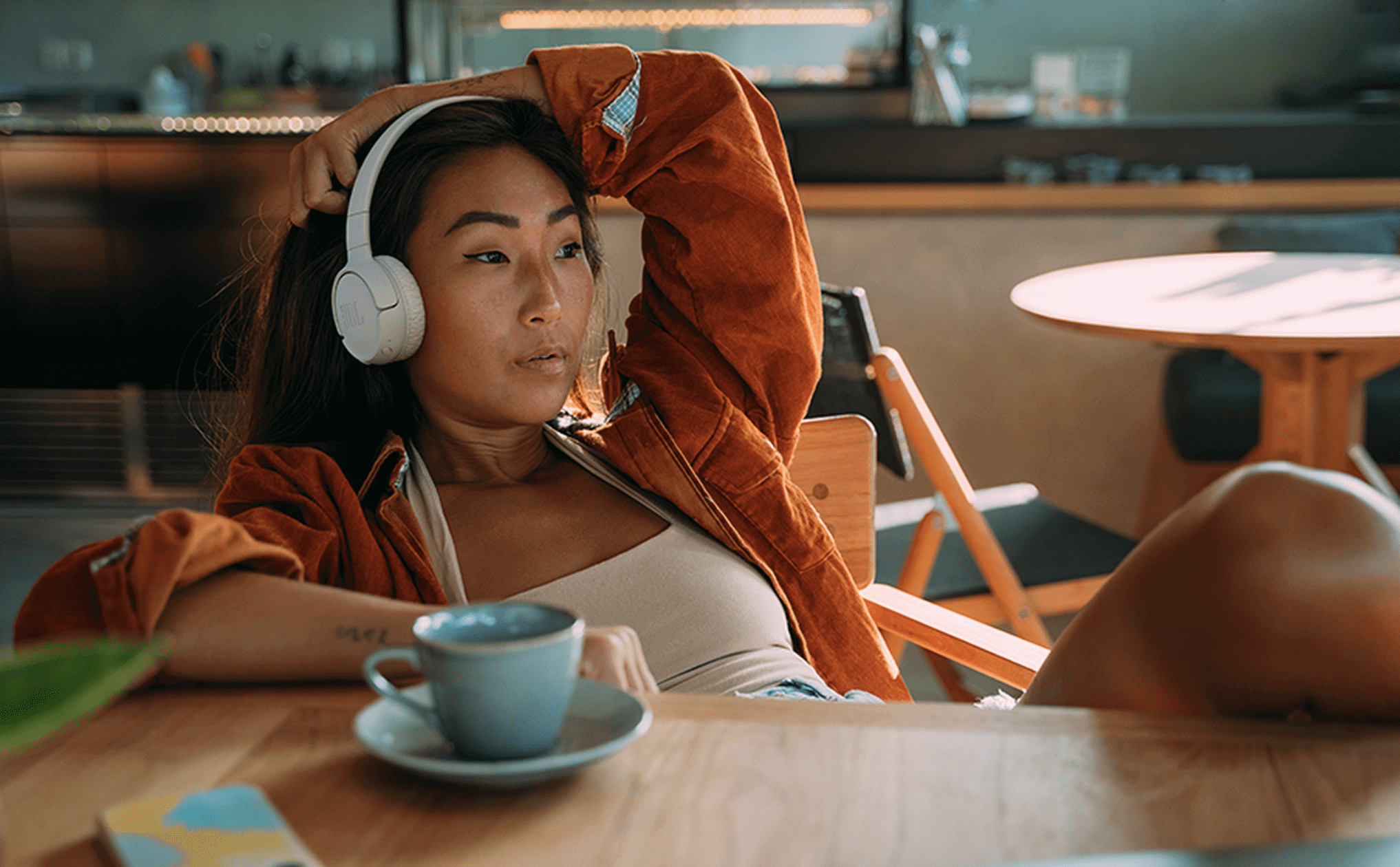 Woman wearing JBL Tune 520BT Headphones