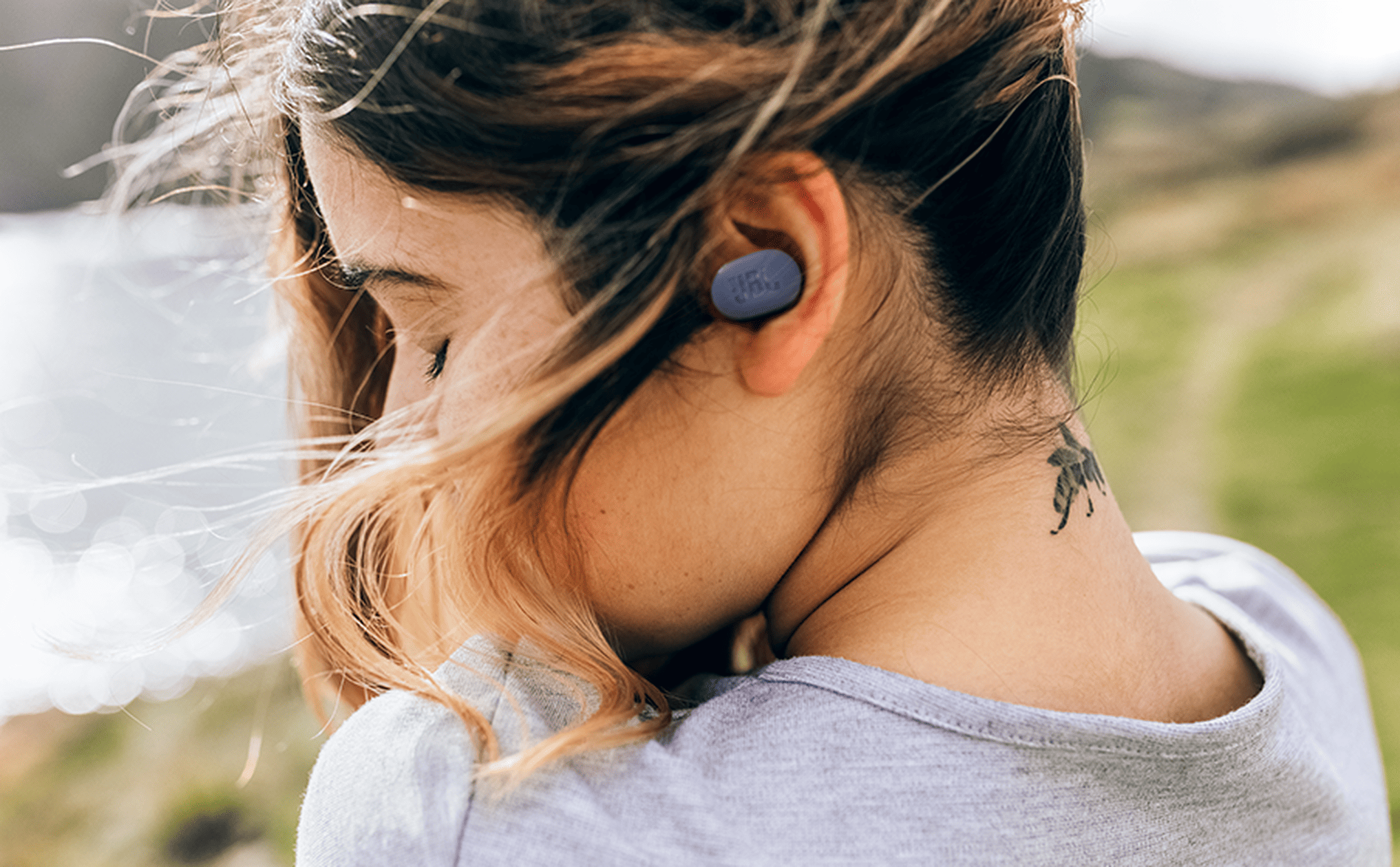 Woman wearing JBL Tune Buds