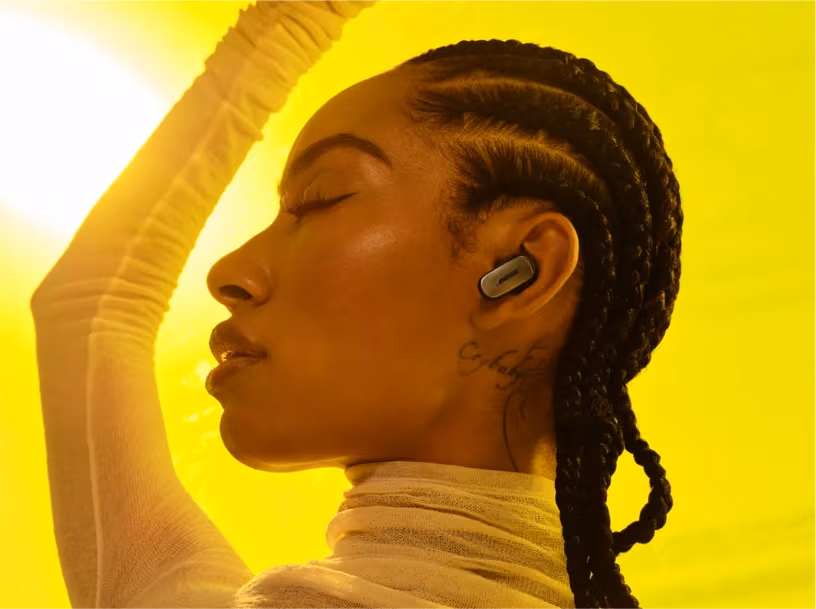 Woman wearing Bose QuietComfort Ultra Earbuds