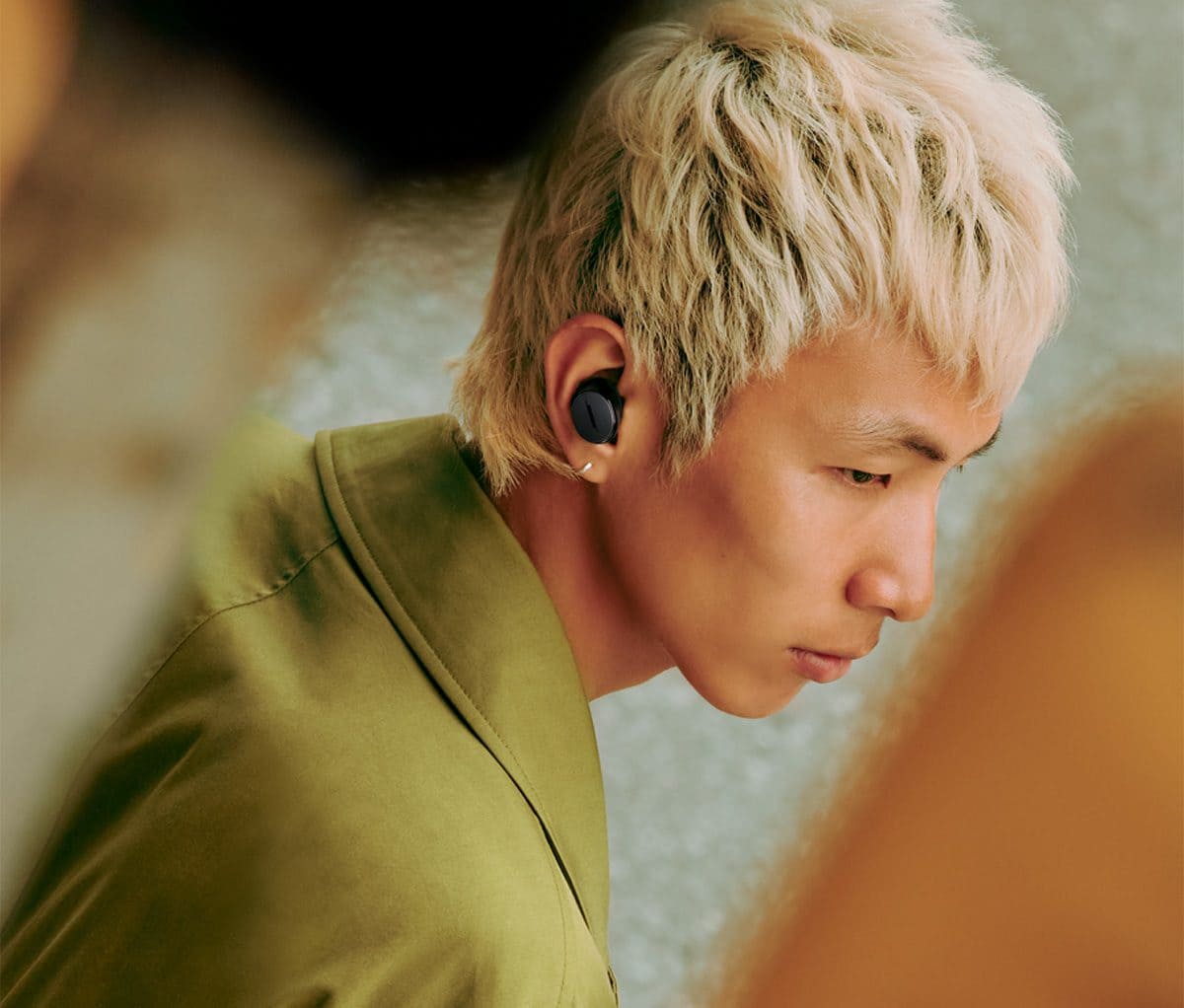 Man wearing Bose QuietComfort Earbuds